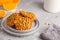 Fresh oatmeal pumpkin cookies on a gray plate, halloween food, a