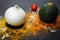 Fresh onion, zucchini, spice tomato, on a black background, top view