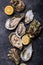 Fresh open Oysters. Healthy sea food. Dinner in restaurant. Gourmet food. Dark background. Top view