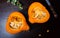 Fresh opened pumpkin on a dark table