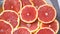 Fresh Orange fruit Slices. Motion rotating of the plate with Slices orange citrus fruit.