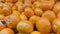 Fresh orange fruits rich in vitamin C are sold in supermarkets