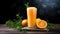 Fresh orange juice with ice and rosemary on a wooden background