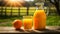 Fresh orange juice in a jug and glass on a sunny morning in the English countryside. Generative Ai