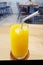 Fresh orange juice with a metal straw