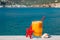 Fresh orange juice on the seaside background.