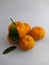 Fresh oranges that have lots of vitamins are on a white background