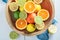Fresh oranges, limes and lemons with on wooden table