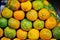 Fresh oranges on marketplace background