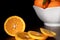 Fresh oranges slices and blurry white porcelain Bowl. Healthy Citrus fruits Kitchen Concept
