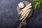 Fresh orgaanic horseradish or Horse-radish root on wooden cutting board.  top view