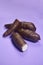 Fresh Organic Cassava Root, Manioc Esculenta, yuca On purple Background