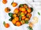 Fresh organic citrus mandarin oranges fruit tangerines, clementines with leaves