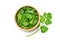 Fresh organic coriander leaves sliced in wooden bowl