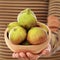 Fresh organic figs in wooden bowl