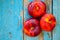 Fresh organic flat nectarines on an old wooden background