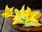 Fresh, organic flowers of zucchini on wooden table. rustic style.