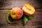 Fresh organic fruit - peaches on wood