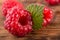 Fresh organic fruit raspberry on wood background