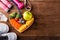Fresh organic fruits and vegetables in heart plate wood and sports equipment and doctor stethoscope