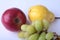 Fresh organic fruits on white background. Assorted apple, pear and grapes.