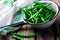 Fresh, organic green beans in a vintage colander