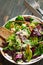 Fresh organic green quinoa salad bowl on dark wooden background