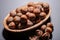 Fresh organic high quality hazelnuts, filberts in wooden bowl on natural stone