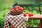 Fresh organic home growth strawberries on wooden table in summer garden