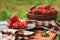 Fresh organic home growth strawberries on wooden table in summer garden