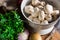 Fresh organic ingredients for preparing healthy vegetarian meal potatoes, mushrooms in colander, halved onion, parsley