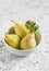 Fresh organic pears in a white bowl