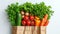 Fresh organic produce in a recyclable paper bag on a white background, concept of sustainable grocery shopping