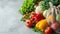 Fresh organic produce in a recyclable paper bag on a white background, concept of sustainable grocery shopping