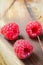 Fresh Organic Raspberry on Rustic Background.