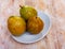 Fresh organic red guavas fruit cut in half on a wooden board. Exotic fruits, healthy eating concept