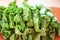 Fresh organic sorrel,plant spinach heap on wooden table for spring green vegetables soup and salad.Raw sorrel leaves top view