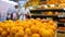 Fresh organic tangerines in grocery boxes at store