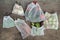 Fresh organic vegetables, fruits and greens in reusable recycled mesh bags on wooden table. Zero waste shopping concept. No single