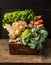 Fresh organic vegetables from garden in old rustic wooden box