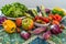 Fresh organic vegetables on a multicolored ceramic surface