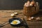 Fresh organic village eggs on wooden table, healthy food,  village food. black pan with fried egg. fresh onion