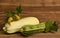 Fresh organic zucchini on wooden table