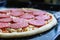 Fresh original Italian raw pizza, preparation on a baking tray in the oven