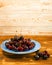 Fresh Overripe ripe Cherries on Blue Rustic Wooden Background