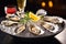 Fresh oyster dish placed on plate with ice and lemon