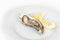 Fresh oyster with lemon. Raw fresh oyster on white round plate, image isolated, with soft focus. Restaurant delicacy.