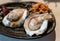 Fresh oyster served in thai style seafood with chili paste and fried onion