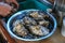 Fresh oysters being washed and prepared