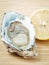 Fresh Oysters with lemon on wooden background. Opened Oysters w